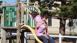 Amy and Susan on the slide.  Camping next to a playground means that kids escape before breakfast and getting dressed sometimes.