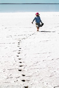 Lucy walking to the water in a salt lake